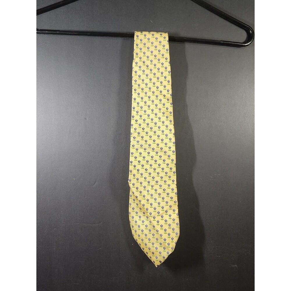 Tommy Hilfiger silk tie features a bright yellow base with a blue geometric...